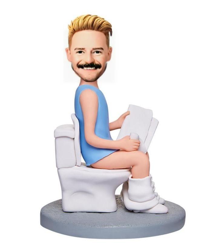 Man_Sitting_On_The_Toilet_And_Reading_A_Book_Custom_Bobblehead_With_Engraved_Text