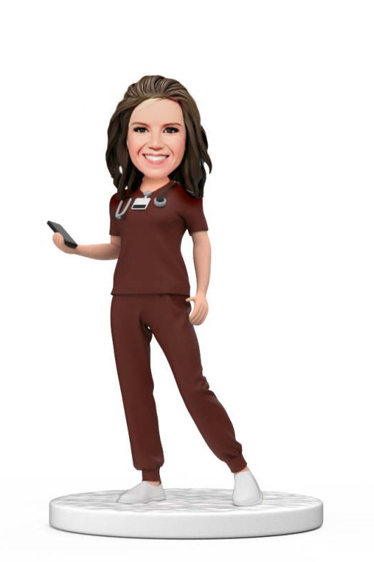 Personalized Female Doctor Bobblehead in Red Scrubs Holding a Mobile Phone with Engraved Text National Doctors Day Gift