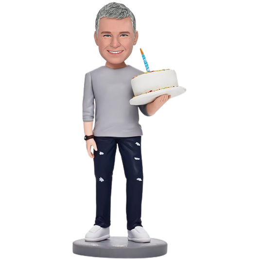 Custom Bobblehead: Birthday Man - A bobblehead featuring a man holding a birthday cake, customizable with engraved text for a special gift.