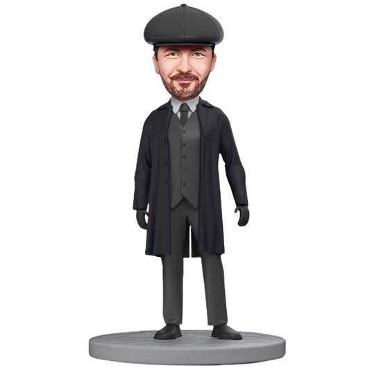 Custom Bobblehead: Shelby in Black Trench Coat - A personalized bobblehead featuring Shelby in a sleek black trench coat, complete with engraved text for a unique and customized touch.